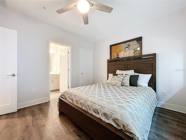 bedroom featuring connected bathroom, ceiling fan, and dark hardwood / wood-style flooring