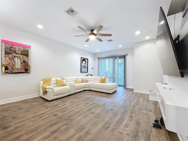 unfurnished living room featuring hardwood / wood-style flooring and ceiling fan