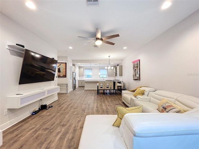 2511 N Grady Ave N Unit 59, Tampa, FL 33607 - living room featuring dark wood-style flooring, a ceiling fan, recessed lighting, and baseboards