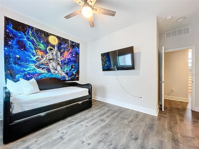 living area featuring ceiling fan and wood-type flooring