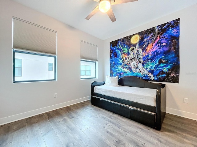 bedroom featuring ceiling fan and hardwood / wood-style floors