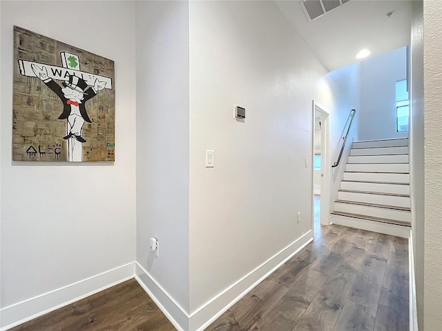 hallway with wood-type flooring