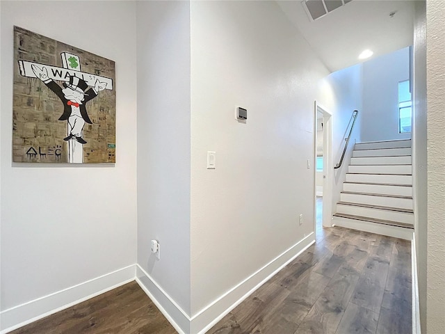 2511 N Grady Ave N Unit 59, Tampa, FL 33607 - hall featuring dark wood finished floors, stairs, and baseboards