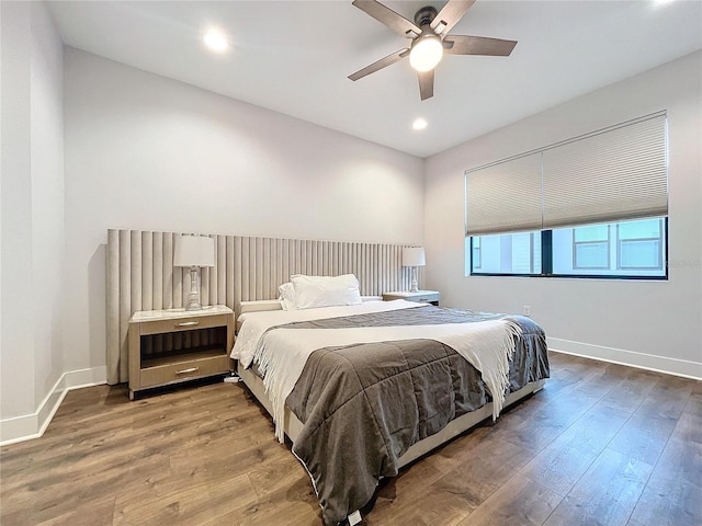 bedroom featuring wood-type flooring and ceiling fan