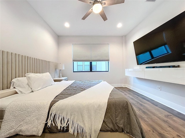 bedroom featuring hardwood / wood-style floors and ceiling fan