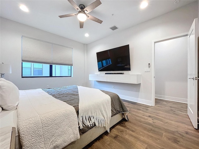 bedroom with wood-type flooring and ceiling fan