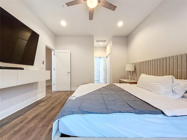 bedroom with ceiling fan and dark wood-type flooring