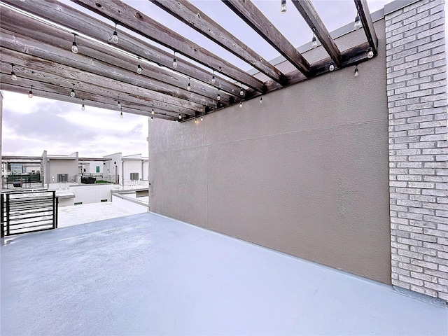 view of patio / terrace with exterior kitchen and a pergola