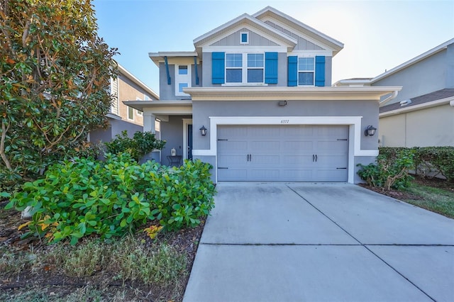 6337 Waves End Pl, Apollo Beach, FL 33572 - traditional-style house with an attached garage, concrete driveway, and stucco siding