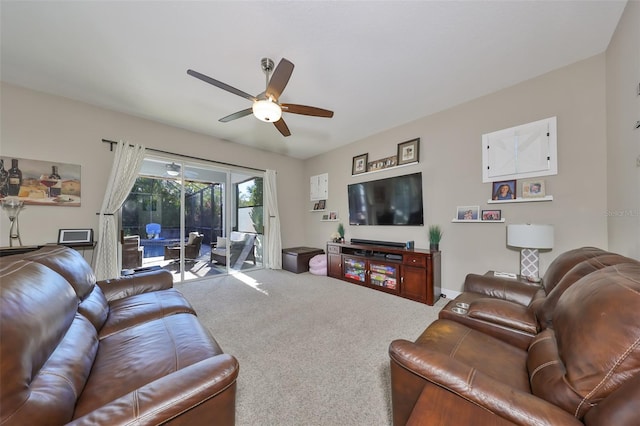 carpeted living room with ceiling fan