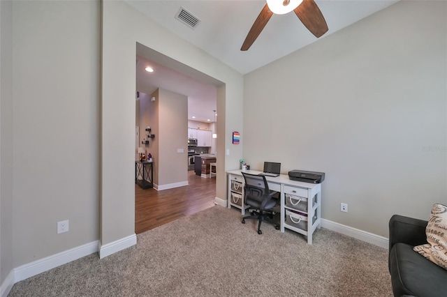 office area featuring ceiling fan and carpet floors