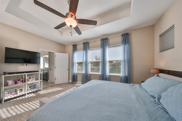 6337 Waves End Pl, Apollo Beach, FL 33572 - bedroom featuring a raised ceiling, carpet floors, baseboards, and ceiling fan