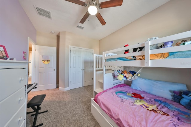 carpeted bedroom with ceiling fan and a closet