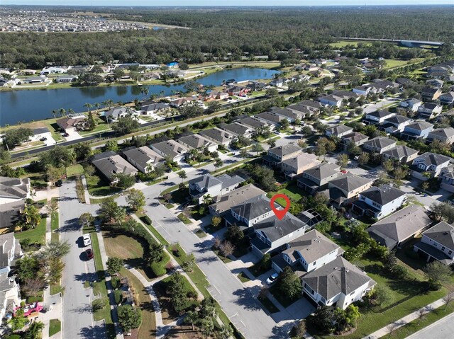 6337 Waves End Pl, Apollo Beach, FL 33572 - aerial view of property's location featuring a large body of water, nearby suburban area, and a heavily wooded area