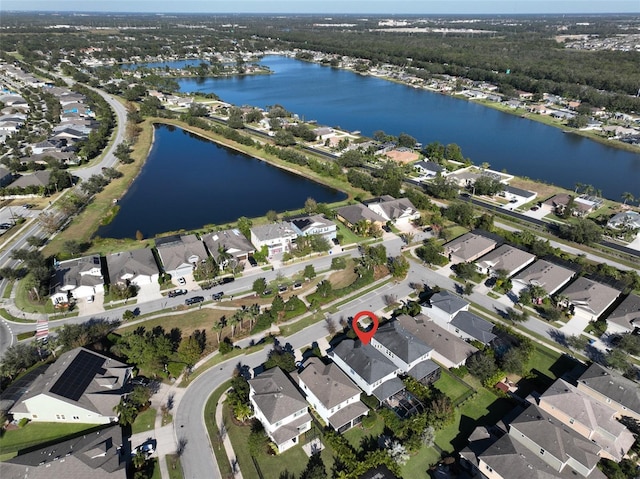 drone / aerial view with a water view