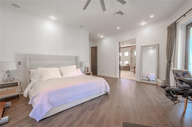 bedroom featuring ornamental molding, ensuite bath, ceiling fan, and light hardwood / wood-style flooring