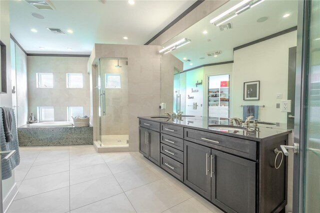 bathroom with vanity, separate shower and tub, tile patterned floors, and crown molding