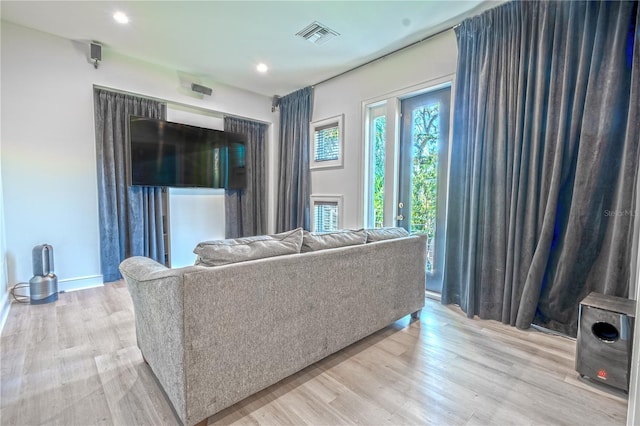 living room with light hardwood / wood-style flooring