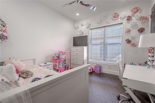 bedroom featuring multiple windows, dark wood-type flooring, ceiling fan, and vaulted ceiling