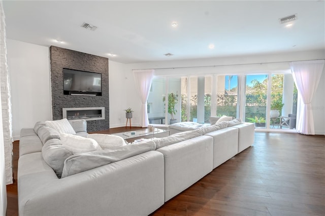 living room featuring hardwood / wood-style flooring and a fireplace