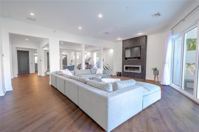 living room featuring hardwood / wood-style floors and a fireplace