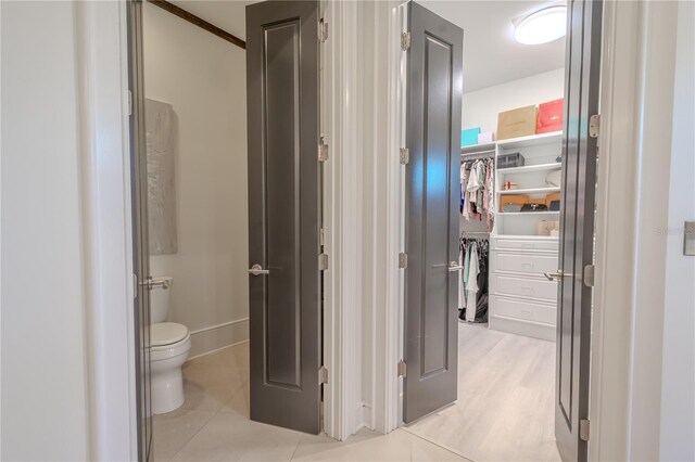 bathroom featuring tile patterned floors and toilet