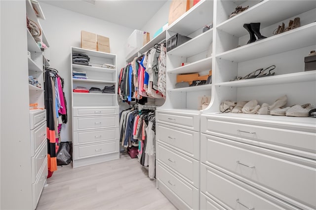 walk in closet featuring light hardwood / wood-style flooring