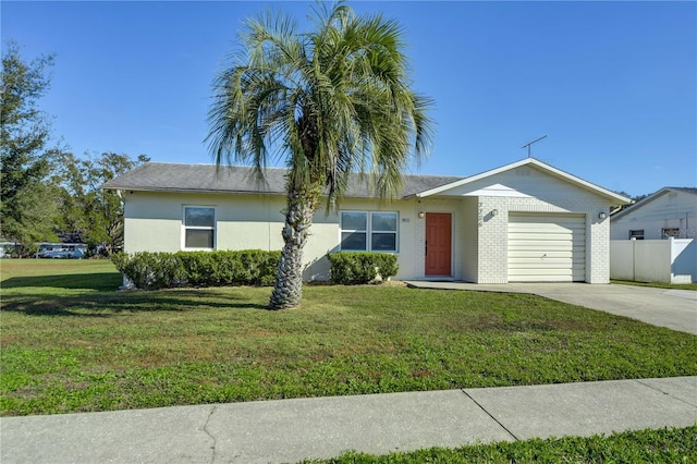 single story home featuring a garage and a front lawn