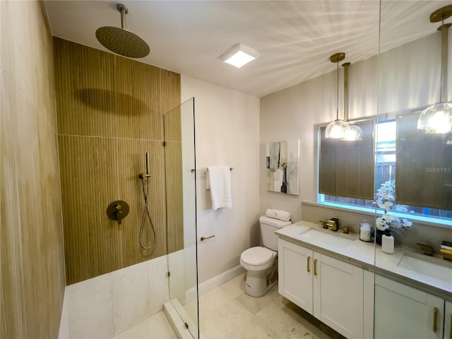 5516 Golden Dr, Tampa, FL 33634 - bathroom with walk in shower, double vanity, toilet, baseboards, and tile patterned flooring