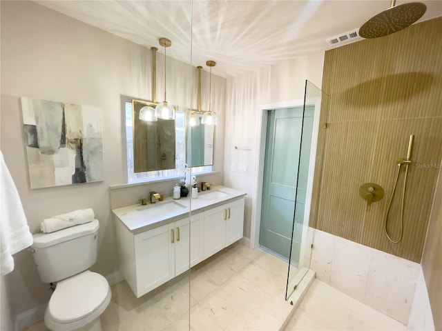 bathroom featuring vanity, toilet, and walk in shower