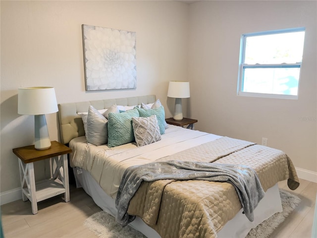 5516 Golden Dr, Tampa, FL 33634 - bedroom with baseboards and wood finished floors