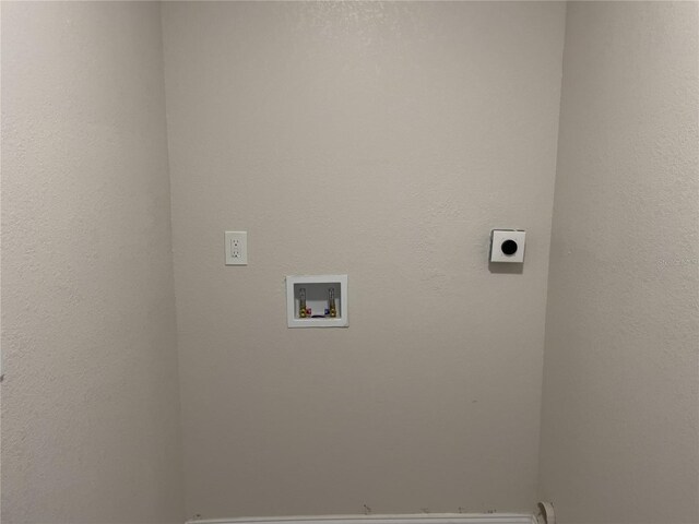 clothes washing area with hookup for an electric dryer and hookup for a washing machine