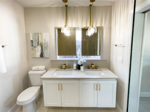 bathroom with vanity and toilet