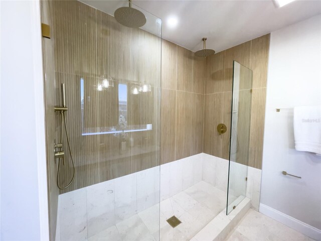 bathroom with tiled shower