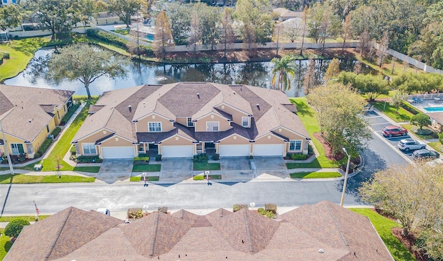 drone / aerial view with a water view