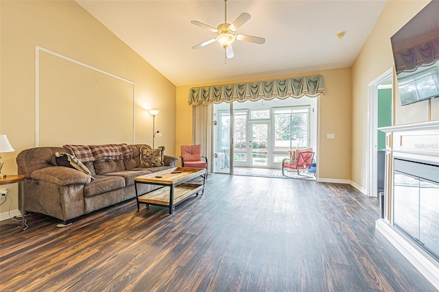 living room with ceiling fan, dark wood-type flooring, and vaulted ceiling