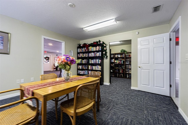 dining room with a textured ceiling