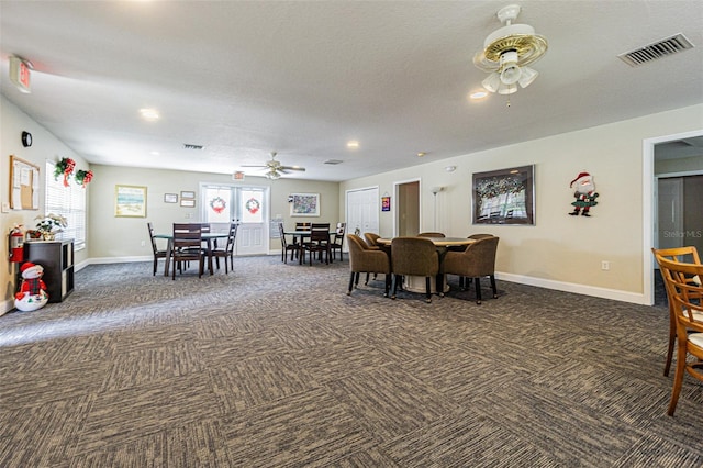 dining room with french doors, a textured ceiling, and ceiling fan