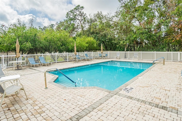 view of swimming pool featuring a patio area