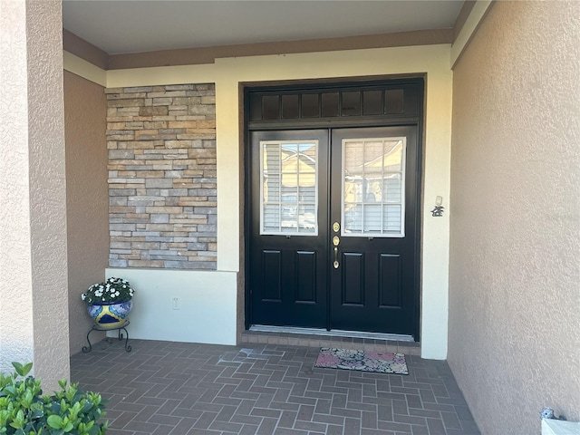 doorway to property featuring french doors