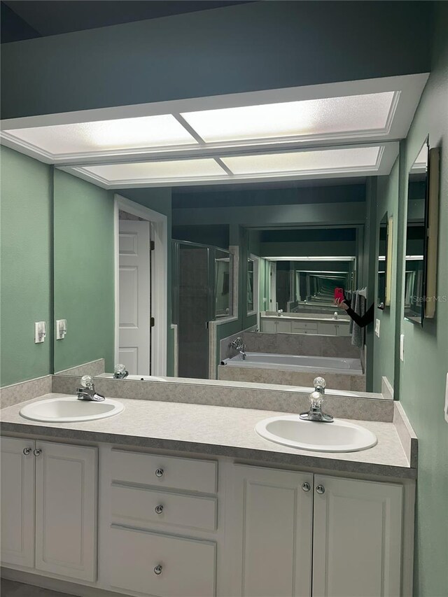 bathroom with vanity and plus walk in shower