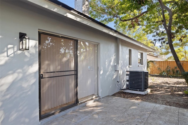 exterior space featuring a patio and cooling unit