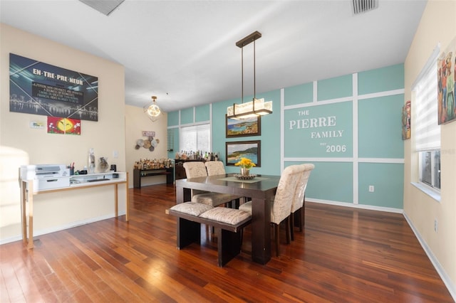 dining room with dark hardwood / wood-style floors