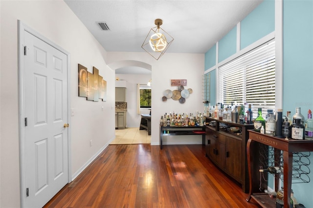 corridor featuring hardwood / wood-style floors