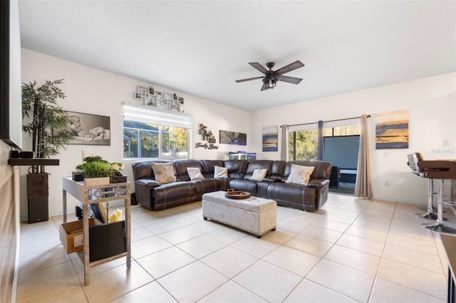 tiled living room featuring ceiling fan