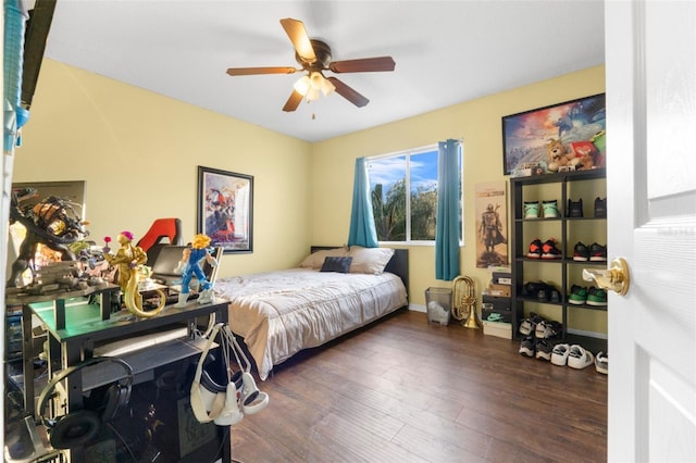 bedroom featuring ceiling fan and dark hardwood / wood-style floors