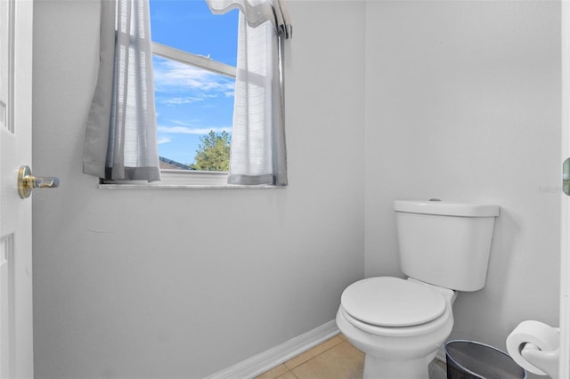 bathroom featuring toilet and tile patterned floors