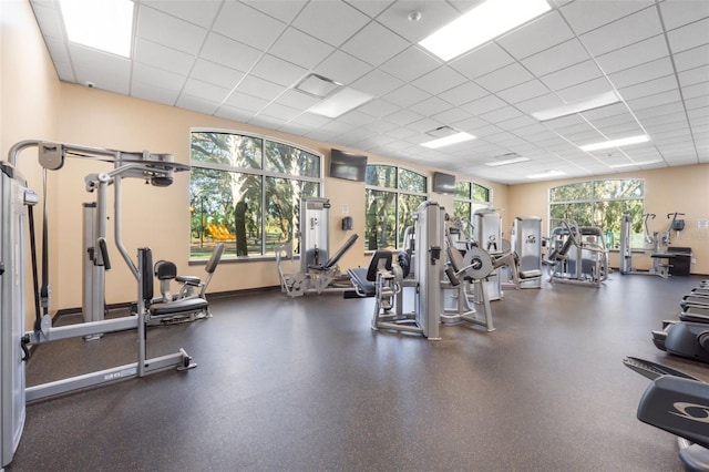 exercise room with a paneled ceiling