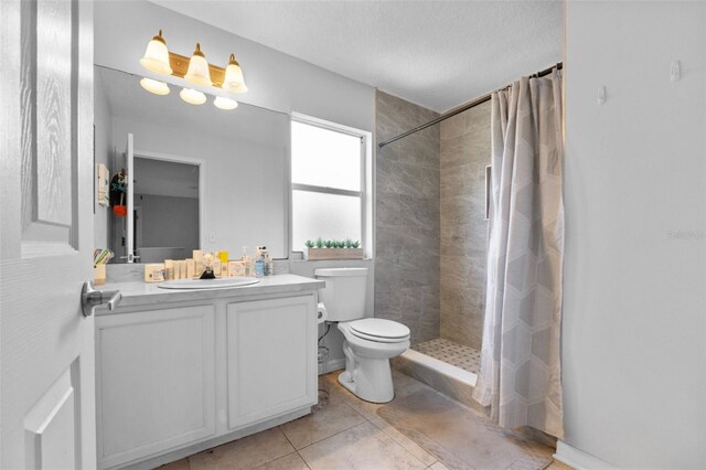 18127 Sandy Pointe Dr, Tampa, FL 33647 - full bathroom with tiled shower, toilet, vanity, and tile patterned flooring