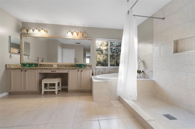 18127 Sandy Pointe Dr, Tampa, FL 33647 - bathroom with tiled shower, tiled bath, tile patterned floors, and double vanity